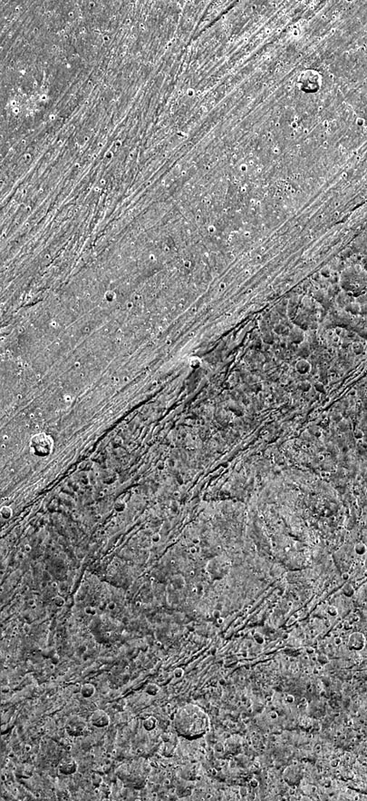 close-up of boundary between a grooved area and dark area on Ganymede